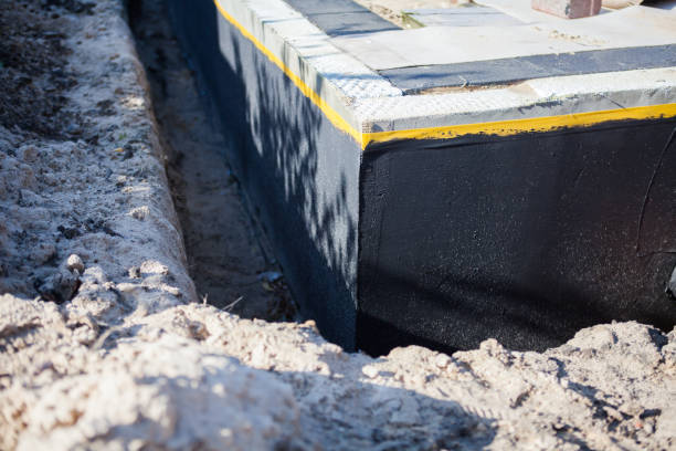 Professional Basement Waterproofing technician working in Stanwood, MI